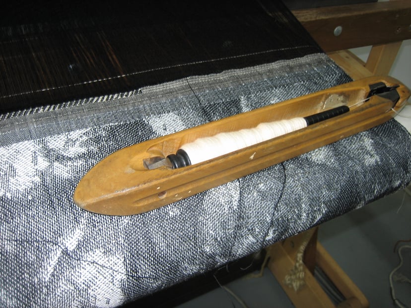 Llançadora volant de John Kay (1733), una invenció que va augmentar la velocitat del teixit.